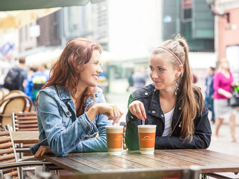 Two women having coffee outside